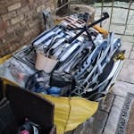 1x Filled megahippo bag household cleanerence; kitchenwares, clothes, garden chairs, bbq stand, crockery/glassware, coat hangers, shoes, office chair, broken mirror, photo frames, chipboard, carpet SL0