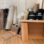 old carpet rolls and two shelf two shelving units and old carpet with underlay NW5