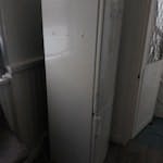 broken fridge large fridge, a bit narrow kitchen door,  stairs front the door BN22