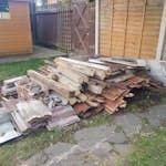 Dismantled old garden shed Approximately 80-85% is various types of wood but there is also bricks, stone/slate/tile, glass, plastic roof sheeting and a couple of old items of shed contents - gardening fork and hosepipe. DA12