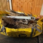 Garden/household rubbish Includes chicken wire fence wrapped around hedge cuttings, couple pieces of guttering, wooden fence post, small plastic fish tank, wooden chair. GU14