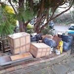 house and garden waste 1 pile loft clearance (wood, plastics, tiles, glass, bagged rubbish, large and small boxes, old electronics, rug etc.) in front garden near road,  2 piles garden waste (tree and shrub cuttings) in back garden via side of house path to access. N10