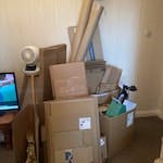 cardboard boxes and tubes flat packed mostly . some could be reused S5