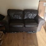 2 seater sofa 2 seater leather sofa. Sunken seats and torn underneath. E14