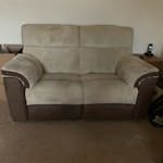 2 seater recliner sofa 2 seater recliner sofa with surface stains, does come apart in 2 pieces but no idea how to do it. BH23