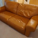 leather sofa for disposal. has hole in bottom. easy access. ground floor location. WA15