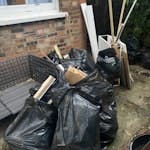 assortment of waste assortment of waste incl some builders rubble (tiles etc), wood offcuts, cardboard etc. approx 31 bags of varying weights and old back door. we live in a ground floor flat and there is parking outside. happy for this to be collected during the week too. N19