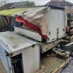 Old cheese trailer and freezer An old cheese trailer and unusable commercial freezer . TW14