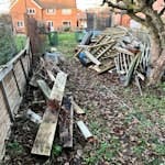 Wood, paving slabs, assorted DIY and garden waste. In two piles (one small and one larger - both visible in pictures). AL4