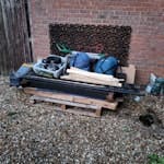 Cardboard, bed parts etc. About 3 cubic yards of general junk. Mostly cardboard and bits of an old bed. Also a pallet, some small appliances and old camping gear and couple of bits of glass. RG22