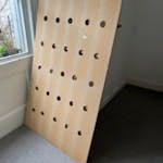 2 Large chip pegboards 2 pieces of chipboard with peg holes. Good condition, with a few paint marks on. BN1