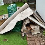 cardboard boxes, a rug, misc cardboard boxes, old rug (might be reusable if cleaned), bagged rubbish, some wood and mdf boards. SE23
