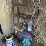 Small shed few bits in garden Small shed, metal cupboard and wooden shelf stand N1