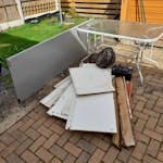 house hold waste old wardrobe, garden table, car battery, hanging baskits LL32