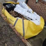 hippo skip bag of rubbish Rubbish is some household, diy, timber and a couple of bags of garden waste. Skip bag is located in back garden about 25m from the road via 1m wide side alley. RM12